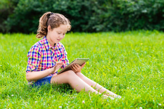 Girl playing on tablet.jpg