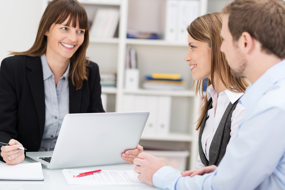 tax consultant smiling with clients